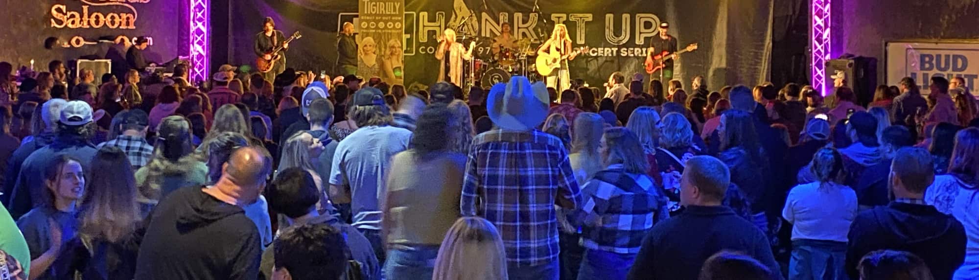 country concert with fans wearing cowboy hats Reno