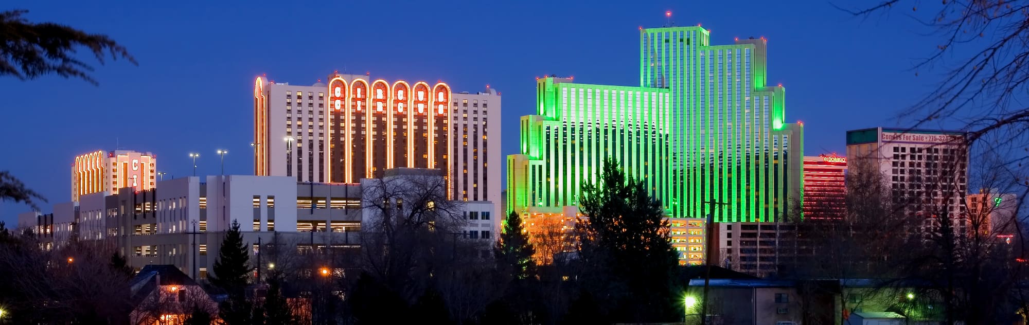 Neon color image of a band playing and people singing along